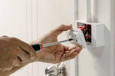Handyman Fixing Electrical Outlet